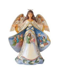 nacimiento de navidad sobre un angel de porcelana